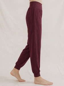 Women's high waist yoga jogger pants in deep wine red with elastic cuffs and soft texture