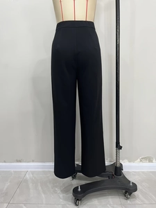 Elegant black high waisted straight leg suit trousers with asymmetrical waist detail