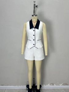 Women's two-piece fashion set with contrast lapel vest and matching white shorts