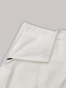 Detail of white textured fabric waistband featuring a high-quality side invisible zipper closure
