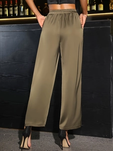 Elegant high waist wide-leg pants in glossy olive satin for a sophisticated party look