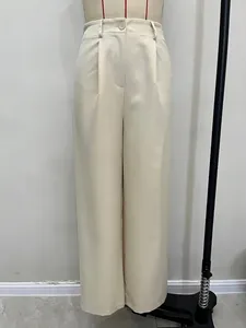 High-waisted wide-leg trousers in beige with pleated details and a fluid straight-cut fit