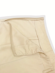 Detail showing the invisible zipper design and smooth stitching on the high waist beige pants