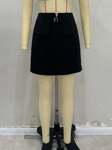 Detailed view of high waisted black mini skirt with silver buckle and flap pockets