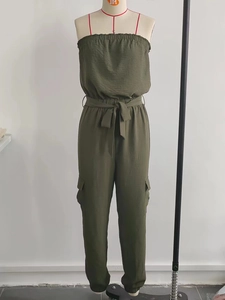 Olive green strapless jumpsuit with elastic waist, drawstring belt, and cargo side pockets