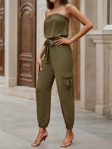 Olive green strapless jumpsuit with drawstring waist and cargo pockets in street style
