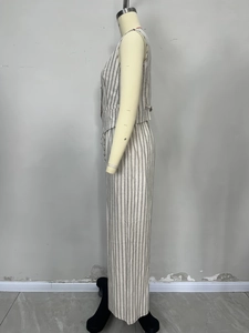 Detail view of side profile showing beige striped linen vest and wide leg trousers set