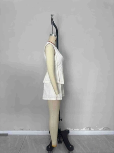 Elegant white two-piece sleeveless peplum top and shorts set with contrast stitching detail