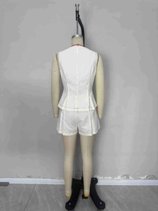 Elegant white two-piece set featuring contrast stitching vest and high-waisted shorts