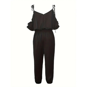Close-up of black jumpsuit featuring ruffled off-shoulder sleeves and drawstring waist