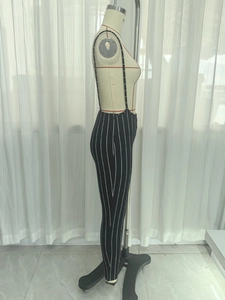 Close-up of vertical pinstripe knit overalls with slim fit and thin straps