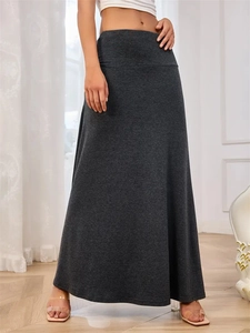 Detail view of high-waist dark grey knitted maxi skirt with soft flowing fabric texture