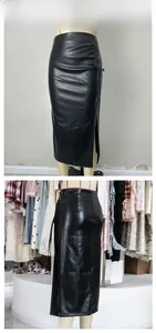 Detailed view of black PU leather skirt with drawstring ruching and side slit design