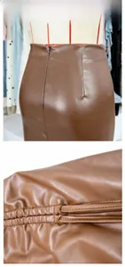 Detail of brown PU leather skirt showing seamless back zipper and fine texture stitching