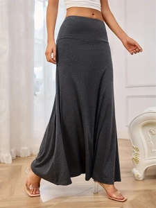 Detailed view of dark gray high-waisted knitted maxi skirt with soft drape fabric