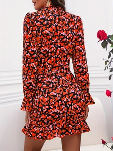 Elegant floral print long sleeve dress with ruffle hem and heart patterns on back