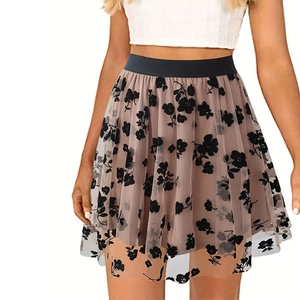 Detail of floral flocked mesh skirt with elastic waistband and high-waist A-line design