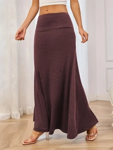 Detail view of high waist knitted maxi skirt in deep purple marl with A-line hem