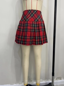 Classic red plaid pleated mini skirt for women featuring high waist and school style design