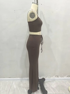 Detail view of dark brown rib-knit crop top and high-waisted flared trousers set