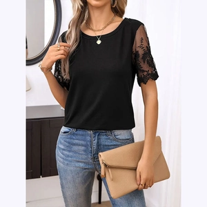 Detail of elegant black knit top featuring intricate lace crochet hollow sleeves design