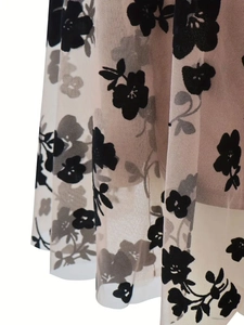 Chic beige mesh skirt with black flocked floral patterns and light pleated hemline