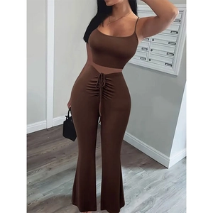 Detailed view of dark brown high waist flared pants with drawstring front ruffles