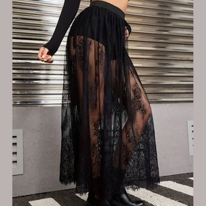Detailed view of a black gothic lace sheer maxi skirt with intricate floral patterns.