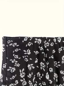 Floral print black mesh midi skirt featuring high waist elastic design and ruffled hem