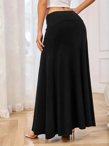 Minimalist high-waisted black knit maxi skirt with elegant wide-swing A-line silhouette