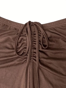 Women's brown ribbed two-piece set featuring a cropped drawstring top and flare pants