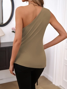 Macro detail of khaki one-shoulder knitted top showing pleated texture and fabric quality