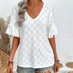 Close-up of white eyelet embroidery fabric with V-neck and ruffle sleeve detail