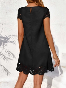 Short sleeve black A-line knit dress featuring laser-cut floral hem and back button detail