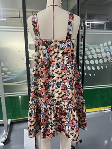 Floral print halter neck maxi dress with ruffle hem on mannequin for summer vacation