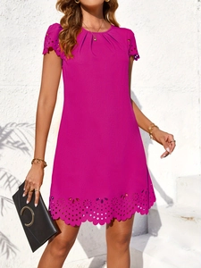Detail of rose red A-line knit dress featuring laser-cut scalloped hem and hollow design