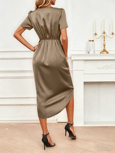 Detail view of smooth satin dress back featuring elastic high waist and puff sleeves