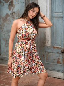 Detail of floral halter neck dress with layered ruffles and matching waist tie