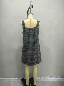 Detailed close-up of a sleeveless tweed houndstooth A-line dress in black and white