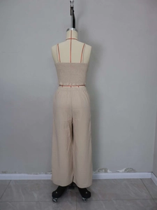 Detail of smocked back camisole and elastic high-waist wide-leg pants in beige set
