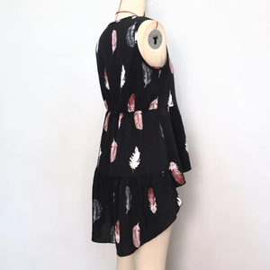 Detail of black feather print sleeveless top with irregular hem and elastic waist