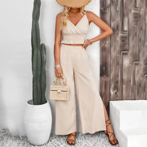 Detailed texture of cream jacquard striped camisole and side slit wide leg pants set