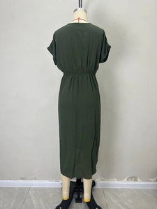 Back view of the dark green short-sleeved maxi dress featuring waist pleats and cinched detail