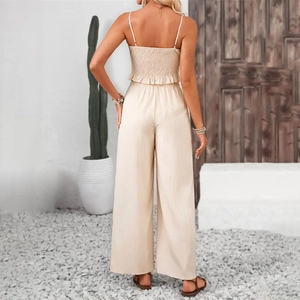 Detail of smocked back and ruffle hem on beige striped summer camisole two-piece set