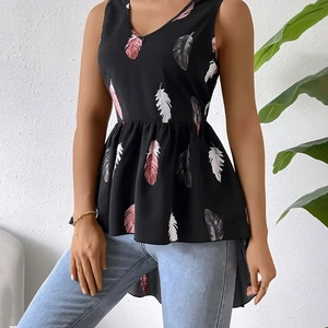 Detail showing V-neck sleeveless peplum top with pink feather print and high-low hem