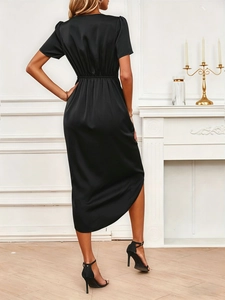 Elegant back view of black satin midi dress with waist folds and subtle puff sleeves