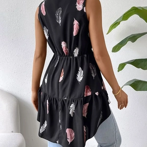 Detail of sleeveless black feather print top with elastic waist and ruffled hem