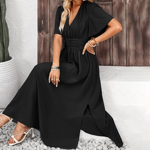 Detailed shot of the ruched elastic waist and ruffled sleeves on this black V-neck maxi dress