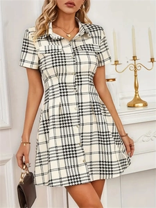 Short sleeve houndstooth shirt dress with a slim fit waist and button-up lapel