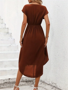 Rear view of caramel brown wrap dress with high waist and irregular high-low hem design